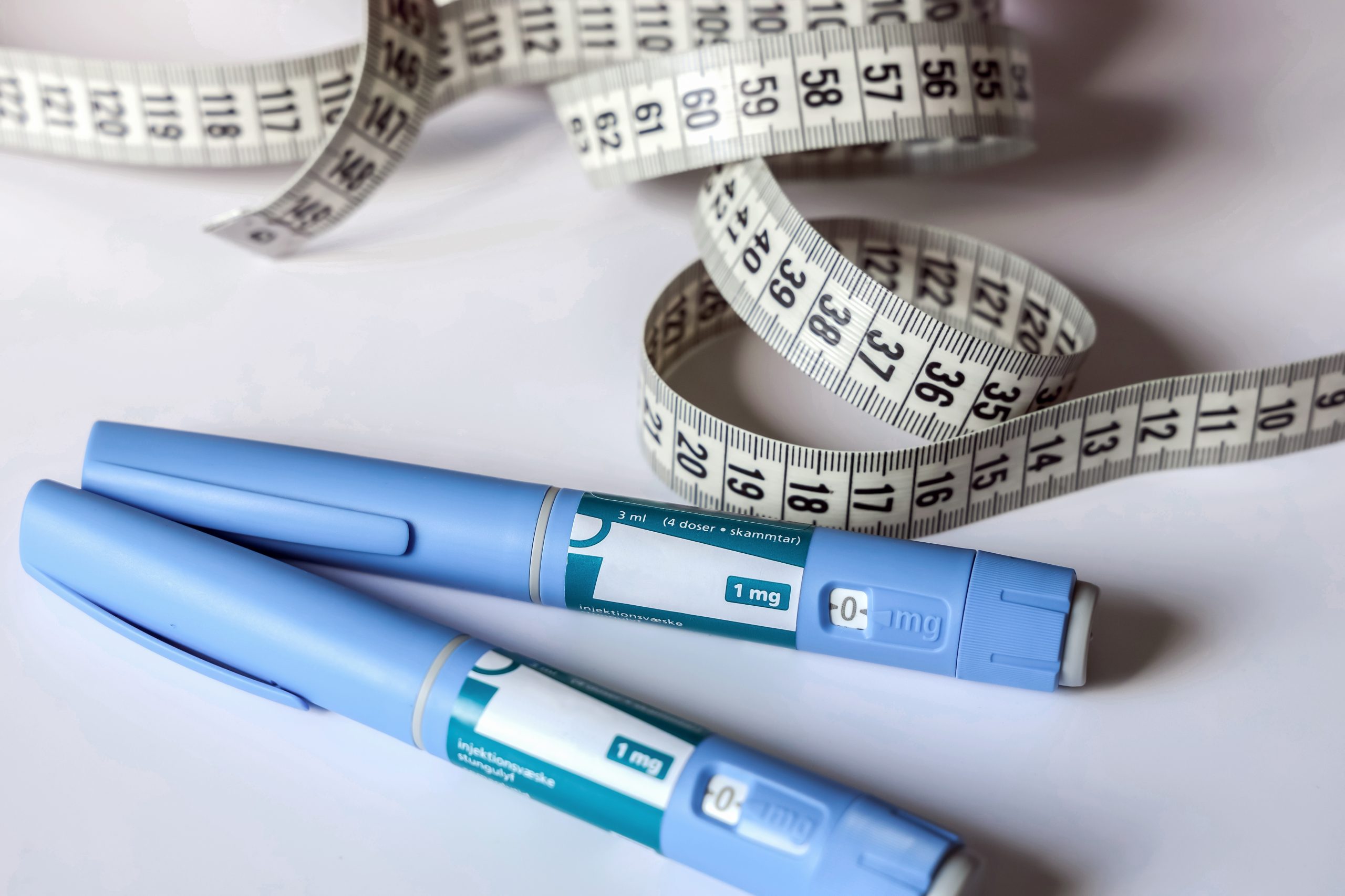 Weight Loss Injectables and Tape Measure